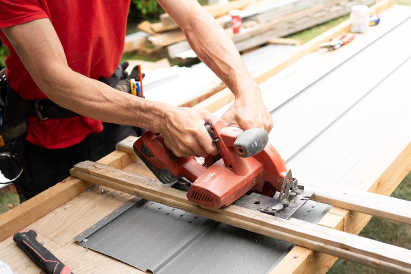 a professional cutting an iron sheet