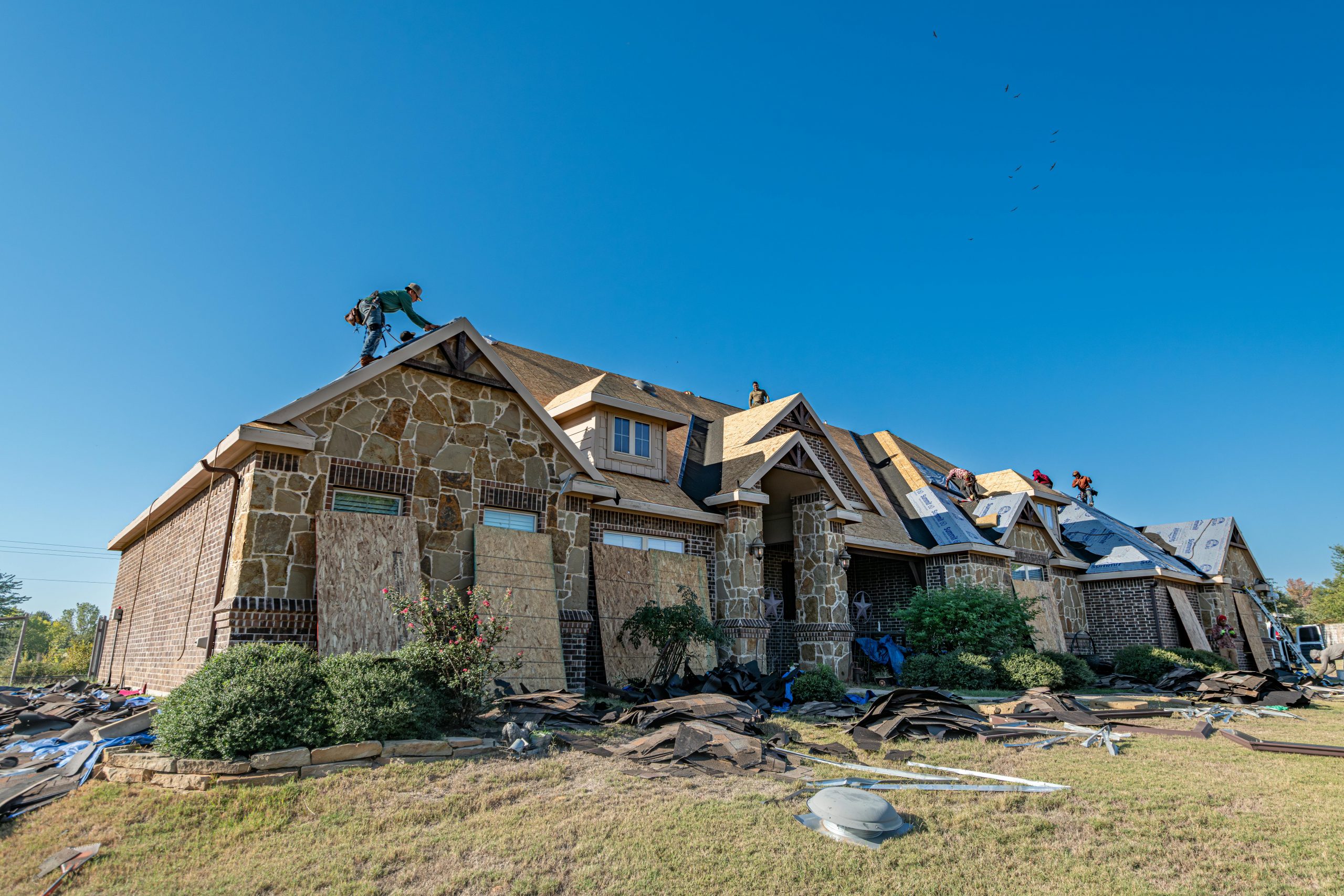 roofers working under clear skies